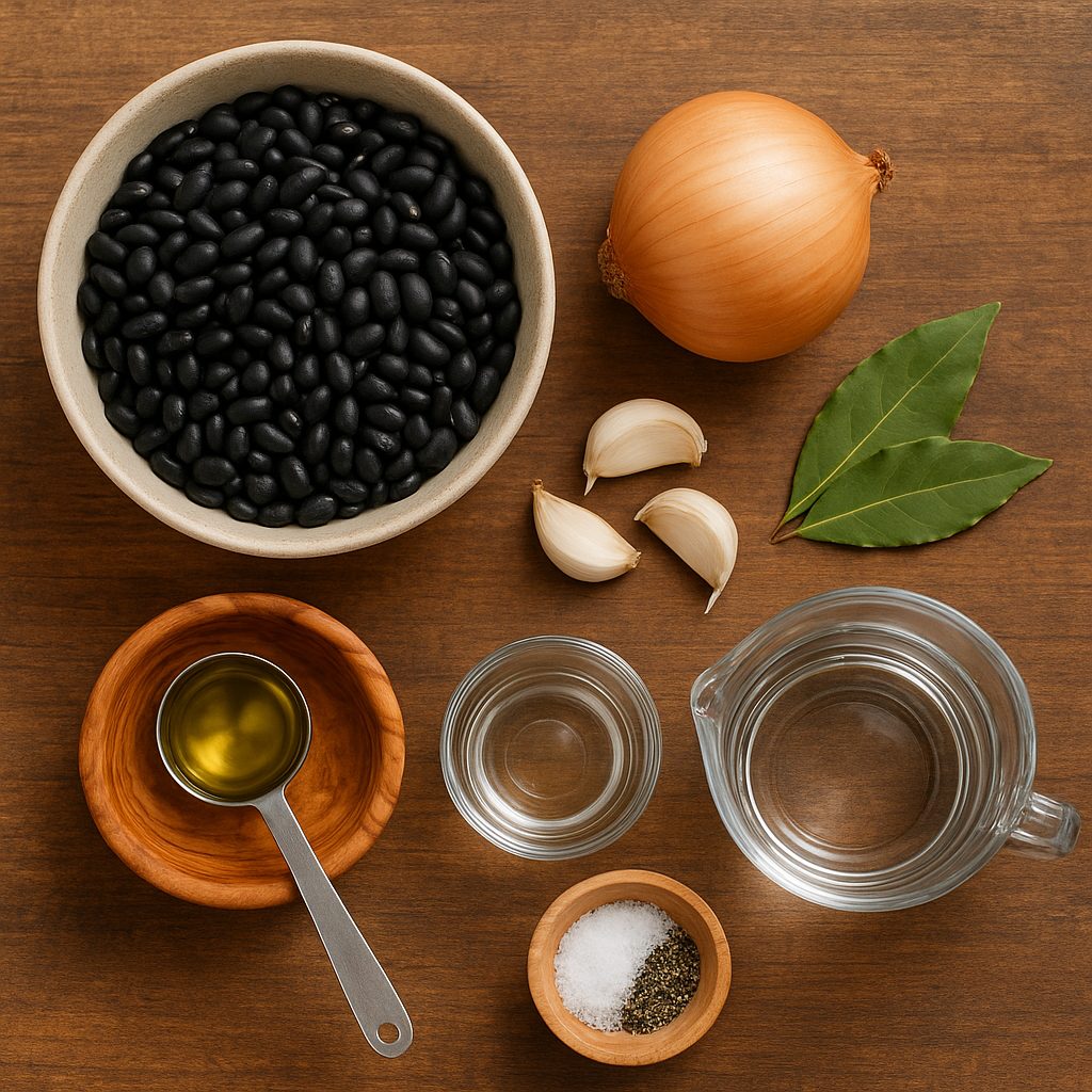 "Ingredientes para preparar feijão brasileño: frijoles negros, cebolla, ajo, hojas de laurel, aceite de oliva, agua, sal y pimienta."